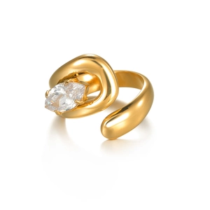 Asymmetric gold serpent open ring with zircon stone inlay on a white background