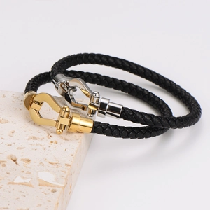 Bracciali in pelle intrecciata con fibbia a ferro di cavallo in acciaio oro e argento