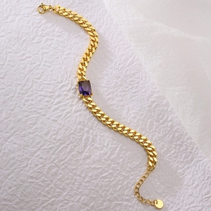 Gold Cuban link bracelet featuring a rectangular purple zircon center stone for women