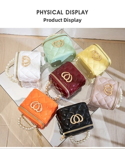Overhead view of colorful quilted mini vanity bags with pearl handles and heart buckles