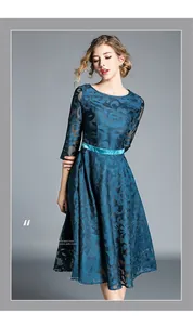Detailed view of floral lace texture and satin waistband on a slim-fit midi dress