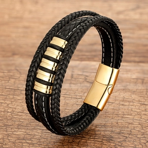 Black multilayer braided leather bracelet with golden metal bars and magnetic clasp