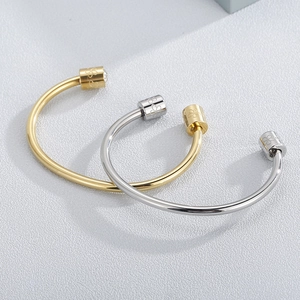 Elegant gold and silver cylinder open bangles with clover engraving and small crystals