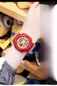 Close-up of red and yellow sport watch with dual display worn on a model wrist