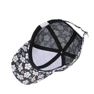 Floral print baseball cap made of 100% polyester with hibiscus pattern on black base