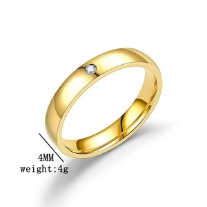 Detail shot of a 4mm gold titanium steel ring with an inset diamond weighing 4g