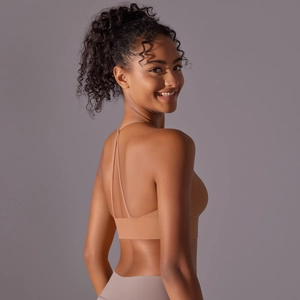 Detail of cross back straps and matte brushed nylon fabric on women sports bra