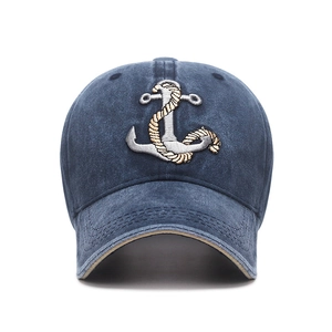 Navy washed faded baseball cap with anchor embroidery and curved brim for casual wear