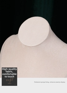 Macro detail of beige velvet jewelry neck display stand with soft sponge padding