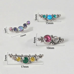 Set of four stainless steel 16g curved lip studs with opal and colorful gemstones