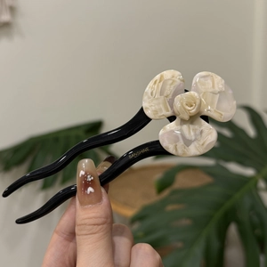 Elegant acetate flower hair pin with cream marble petals and black stick for women