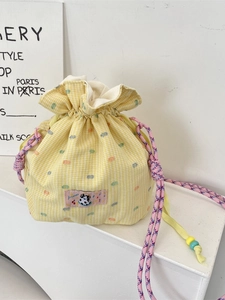 Yellow checkered drawstring bucket bag with cute cow patch and colorful bead accents