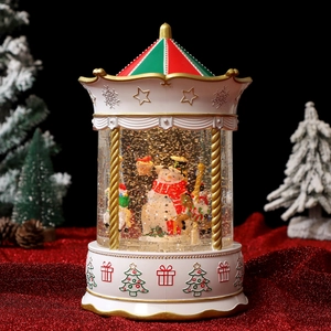 Close-up of a Christmas snow globe carousel with musical lights and drifting snow detail