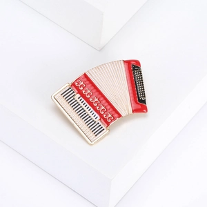 Accordion musical instrument brooch in red and white alloy for elegant coat accessories