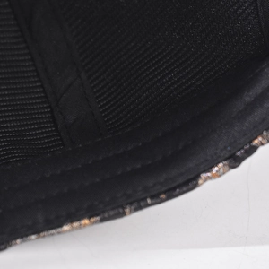 Detail view of baseball cap interior showing parallel stitching and sparkling glitter trim