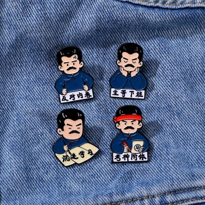 Cartoon Lu Xun enamel pins set with humorous Chinese text on denim fabric background