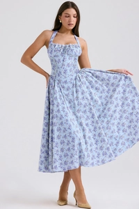 Detail of light blue floral halter maxi dress featuring corset waist and flowing A-line skirt
