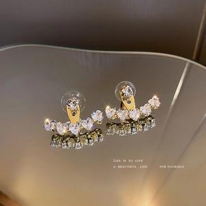 Elegant gold crescent heart zircon earrings with sparkling crystal stones and mirror reflection
