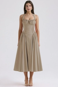 Detail of khaki halter neck floral maxi dress with waist cinching and ruffled hemline