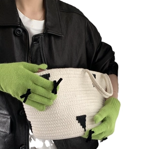 Chic grass green knitted winter gloves with black bows and touchscreen capability