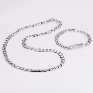 Close-up of hip hop silver cuban chain link necklace and flat rectangular bar bracelet set