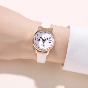 Close-up of cute cat ear watch with white leather strap and rose gold metal bezel