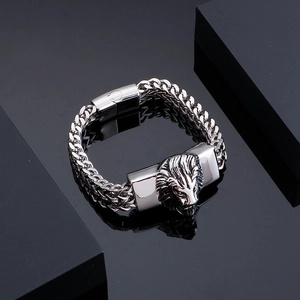Men's silver stainless steel lion head braided bracelet with magnetic clasp on black base