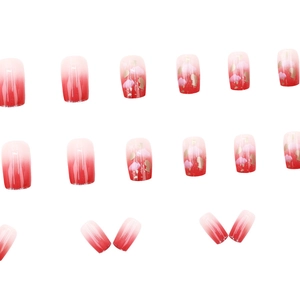 Pink and red gradient press-on nails with gold foil accents and cloud starry patterns