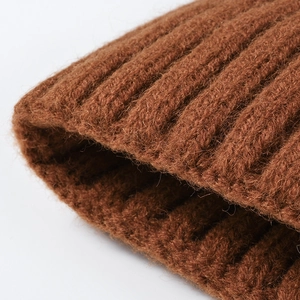 Thick ribbed knit beanie for women in caramel brown showing warm fleece lining texture
