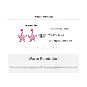 Detailed view of pink raffia starfish earrings showing size of 7.5cm x 5cm and 13.2g weight