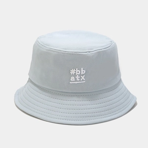 Close-up of light blue cotton bucket hat with white #bb atx embroidery and stitched brim