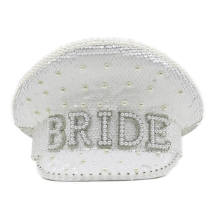 Detail of white sequin wedding hat featuring pearl and rhinestone BRIDE lettering