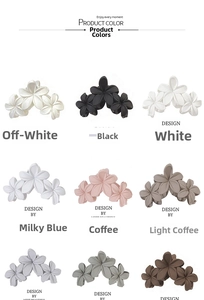 Flat lay of nine matte flower hair claws in multiple colors including cream and blue