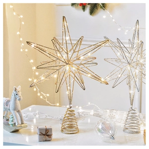 Golden and silver metal LED Christmas tree topper stars with glitter finish in home setting