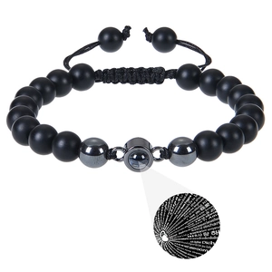 Detail of 8mm matte stone bracelet with 100 languages I Love You projection stone