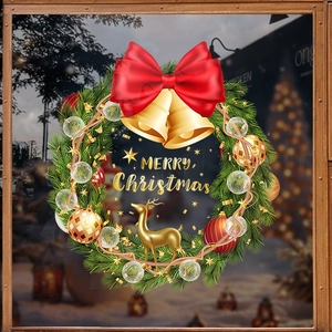 Christmas wreath static window sticker with red bow gold bells and Merry Christmas text