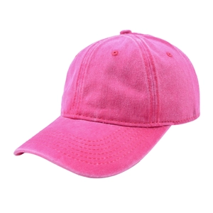Close-up of pink washed cotton baseball cap showing vintage distressed texture and stitching