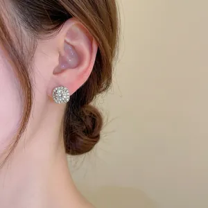 Elegant sterling silver square stud earrings with sparkling pave diamond halo setting