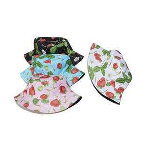 Pastel strawberry print bucket hats for women in pink, blue, white, and black colors