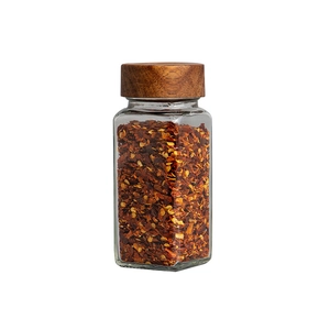 Square 120ml glass spice jar with acacia wood lid filled with red pepper flakes