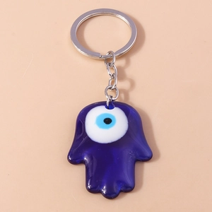 Detail of blue Hamsa Hand keychain with Evil Eye resin pendant and silver metal ring
