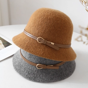 Detail of wool blend bucket hats with brown leather belts and gold metal buckles
