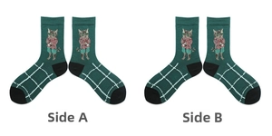 Detail view of dark green socks with cartoon cat embroidery and white grid patterns