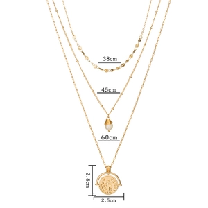 Three-layer layered necklace with gold chains, round coin pendant, and stone charm detail