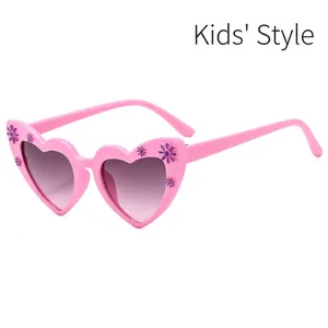 Pink heart-shaped children sunglasses with purple floral accents and gradient lenses