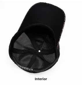 Detailed internal view of black baseball cap showing breathable mesh lining and seam quality