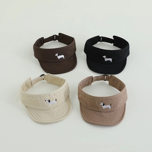 Top view of four color adjustable sun visor caps with cartoon dachshund embroidery