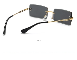 Rear view of rimless square sunglasses with gold metal temples and dark gray lenses