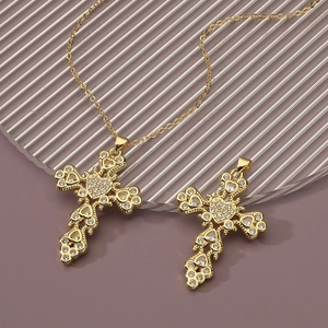 Religious cross pendant necklace with gold plating and sparkling cubic zirconia stones