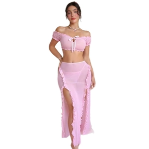 Pink sheer mesh two-piece set featuring off-shoulder bow top and ruffled high slit maxi skirt